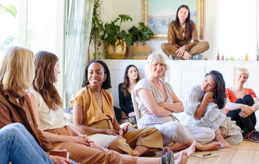 Captured in a moment of solidarity and strength, this photo showcases a diverse group of women sitting in a circle during a support group session. Their expressions reflect a blend of empathy, understanding, and encouragement as they openly share their experiences and offer each other unwavering support. In this safe space, friendships are formed, barriers are broken, and the transformative power of shared stories shines brightly.